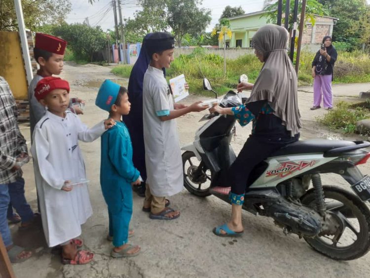Berbagi Di Bulan Suci Ramadhan Rumah Qur’an Rohani (RQR)